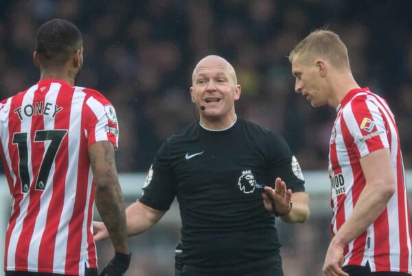 LIVERPOOL, ENGLAND - Saturday, March 11, 2023: Referee Simon Hooper is surrounded by Brentford's players during the FA Premier League match between Everton FC and Brentford FC at Goodison Park. (Pic by Jessica Hornby/Propaganda)