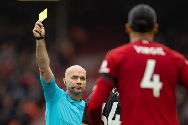 LIVERPOOL, ENGLAND - Sunday, April 9, 2023: Referee Paul Tierney shows a yellow card to Liverpool's Virgil van Dijk during the FA Premier League match between Liverpool FC and Arsenal FC at Anfield. The game ended in a 2-2 draw. (Pic by David Rawcliffe/Propaganda)