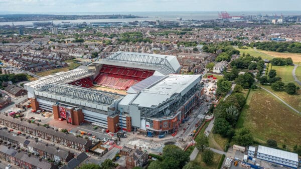 LIVERPOOL, ENGLAND - Friday, July 7, 2023: An aerial view of Anfield, the home stadium of Liverpool Football Club, showing the ongoing construction of the new Anfield Road expansion. The redevelopment of the stand will see 7,000 more seats added taking Anfield's overall capacity to more than 61,000. The construction of Everton Football Club's new stadium at Bramley-Moore Dock dock can be seen in the background. (Pic by David Rawcliffe/Propaganda)