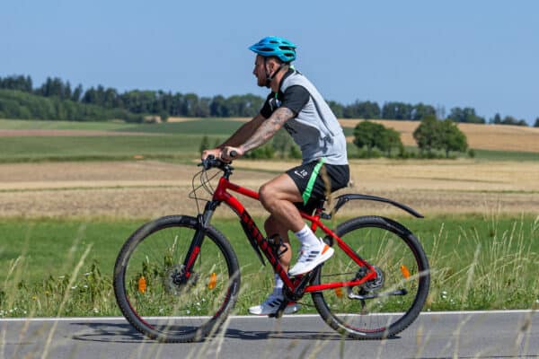 DONESCHINGEN, GERMANY - Tuesday, July 18, 2023: Liverpool's Alexis Mac Allister rides to a training session on a bike during a pre-season training camp in Germany. (Pic by David Rawcliffe/Propaganda)