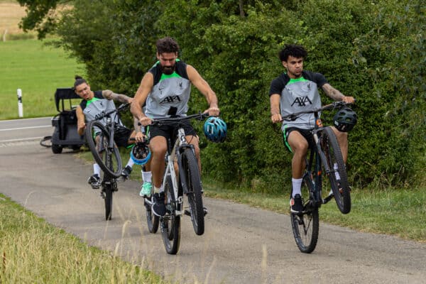 DONESCHINGEN, GERMANY - Saturday, July 22, 2023: Liverpool's goalkeeper Alisson Becker (L) and Luis Díaz (R) pull wheelies as they rides back to the team hotel on bikes after a morning training session during a pre-season training camp in Germany. (Pic by David Rawcliffe/Propaganda)