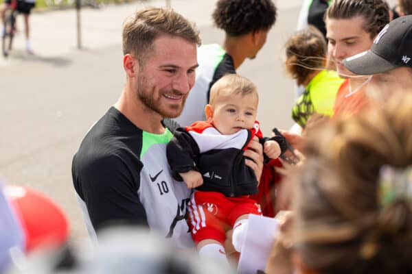 DONESCHINGEN, GERMANY - Sunday, July 23, 2023: Liverpool's Alexis Mac Allister poses for a photograph with a baby before a pre-season training session at their camp in Germany. (Pic by David Rawcliffe/Propaganda)