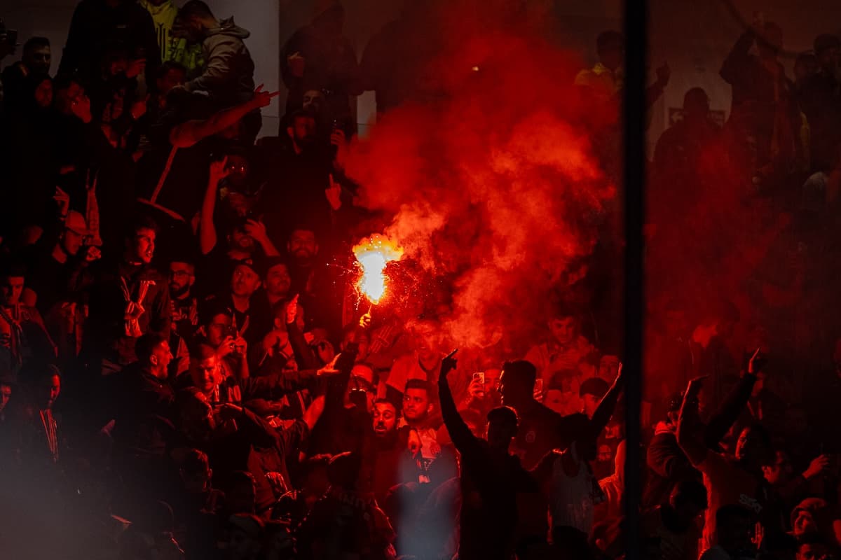 MANCHESTER, ENGLAND - Tuesday, October 3, 2023: Galatasaray supporters set off red flares as they celebrate during the UEFA Champions League Group A match between Manchester United FC and Galatasaray S.K. at Old Trafford. Galatasaray won 3-2. (Pic by David Rawcliffe/Propaganda)