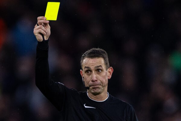 MANCHESTER, ENGLAND - Saturday, December 30, 2023: Referee David Coote shows a yellow card during the FA Premier League match between Manchester City FC and Sheffield United FC at the City of Manchester Stadium. Man City won 2-0. (Photo by David Rawcliffe/Propaganda)