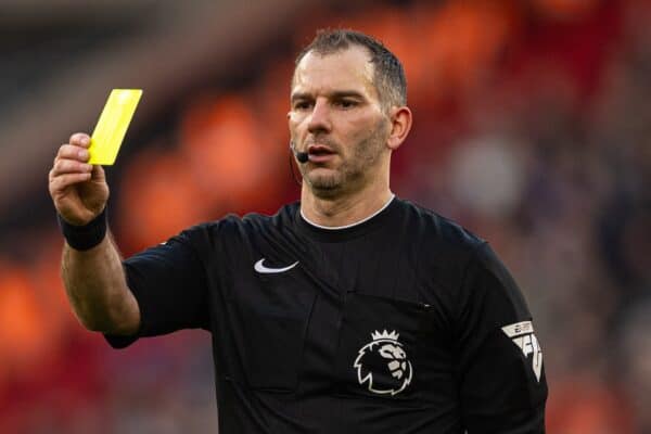 LIVERPOOL, ENGLAND - Saturday, February 10, 2024: Referee Tim Robinson shows a yellow card during the FA Premier League match between Liverpool FC and Burnley FC at Anfield. Liverpool won 3-1. (Photo by David Rawcliffe/Propaganda)