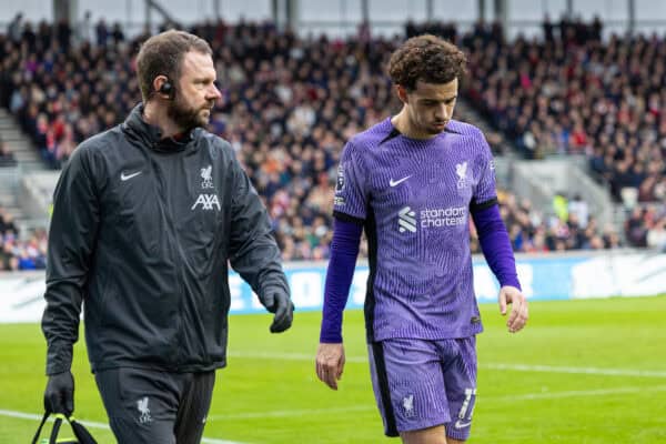LONDON, ENGLAND - Saturday, February 17, 2024: Liverpool's Curtis Jones goes off with an injury escorted by first-team physiotherapist Chris Morgan during the FA Premier League match between Brentford FC and Liverpool FC at the Brentford Community Stadium. Liverpool won 4-1. (Photo by David Rawcliffe/Propaganda)