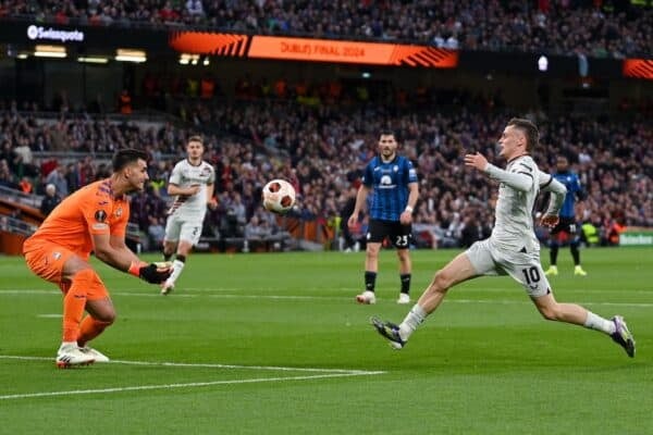 DUBLIN, IRELAND - MAY 22: Atalanta BC goalkeeper Juan Musso catches the ball on the edge of his area under pressure from Florian Wirtz of Bayer 04 Leverkusen during the UEFA Europa League 2023/24 final match between Atalanta BC and Bayer 04 Leverkusen at Dublin Arena on May 22, 2024 in Dublin, Ireland. (Handout photo from UEFA)