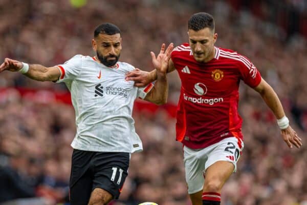 MANCHESTER, ENGLAND - Sunday, September 1, 2024: Liverpool's Mohamed Salah (L) is challenged by Manchester United's Diogo Dalot during the FA Premier League match between Manchester United FC and Liverpool FC at Old Trafford. Liverpool won 3-0. (Photo by David Rawcliffe/Propaganda)