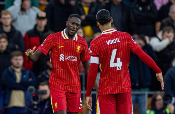 WOLVERHAMPTON, ENGLAND - Saturday, September 28, 2024: Liverpool's Ibrahima Konaté (L) celebrates with team-mate captain Virgil van Dijk after scoring the opening goal during the FA Premier League match between Wolverhampton Wanderers FC and Liverpool FC at Molineux Stadium. (Photo by David Rawcliffe/Propaganda)