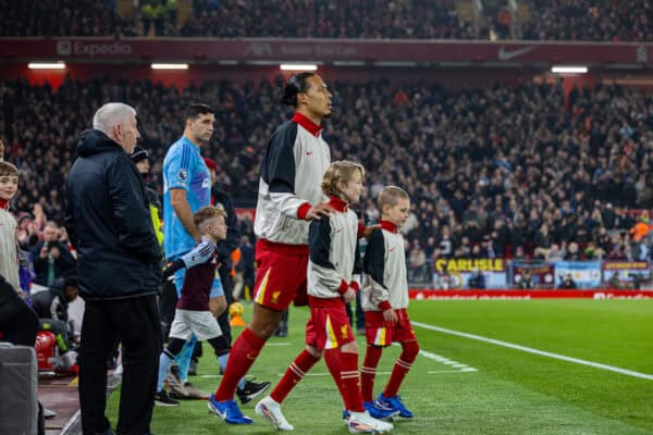 LIVERPOOL, ENGLAND - Saturday, November 9, 2024: Liverpool's captain Virgil van Dijk walks out with mascots before the FA Premier League match between Liverpool FC and Aston Villa FC at Anfield. Liverpool won 2-0. (Photo by David Rawcliffe/Propaganda)