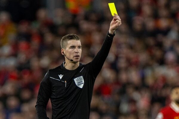 LIVERPOOL, ENGLAND - Wednesday, November 27, 2024: Referee François Letexier shows a yellow card during the UEFA Champions League game between Liverpool FC and Real Madrid CF at Anfield. (Photo by David Rawcliffe/Propaganda)