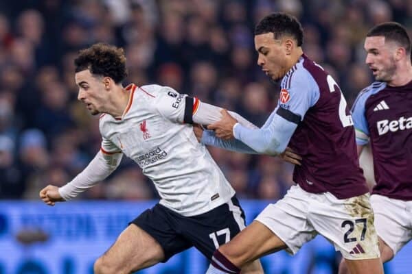 BIRMINGHAM, ENGLAND - Wednesday, February 19, 2025: Liverpool's Curtis Jones (L) is pulled back by Aston Villa's Morgan Rogers during the FA Premier League match between Aston Villa FC and Liverpool FC at  Villa Park. The game ended in a 2-2 draw. (Photo by David Rawcliffe/Propaganda)