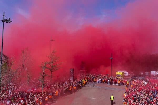 LIVERPOOL, ENGLAND - Sunday, April 27, 2025: Liverpool supporters set off red smoke bombs as they welcome the team bus before the FA Premier League match between Liverpool FC and Tottenham Hotspur FC at Anfield. (Photo by David Rawcliffe/Propaganda)
