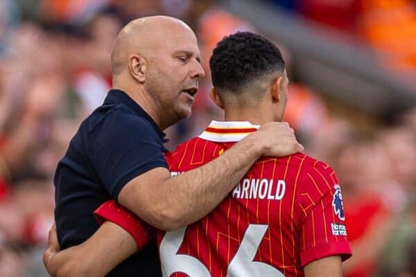 LIVERPOOL, ENGLAND - Sunday, May 11, 2025: Liverpool's head coach Arne Slot puts an arm around substitute Trent Alexander-Arnold as he prepares to bring him on during the FA Premier League match between Liverpool FC and Arsenal FC at Anfield. The game ended in a 2-2 draw. (Photo by David Rawcliffe/Propaganda)
