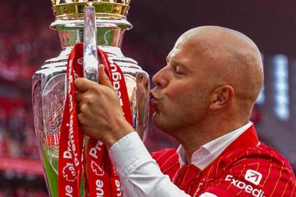 LIVERPOOL, ENGLAND - Sunday, May 25, 2025: Liverpool's head coach Arne Slot kisses the trophy, as the team celebrate becoming Champions for the 20th time, after the FA Premier League match between Liverpool FC and Crystal Palace FC at Anfield. (Photo by David Rawcliffe/Propaganda)