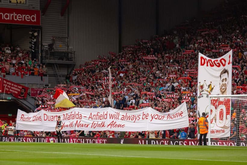 LIVERPOOL, ENGLAND - Friday, August 15, 2025: Liverpool supporters' banner "Rute, Dinis, Duarte, Mafalda - Anfield will always be your home" as the supporters pay tribute to Diogo Jota, who died in a car accident in July, before the FA Premier League match between Liverpool FC and AFC Bournemouth at Anfield. Liverpool won 4-2. (Photo by David Rawcliffe/Propaganda)