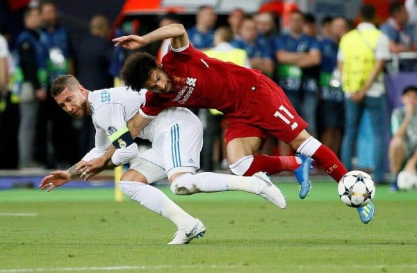 2CPD2PP Soccer Football - Champions League Final - Real Madrid v Liverpool - NSC Olympic Stadium, Kiev, Ukraine - May 26, 2018 Liverpool's Mohamed Salah injures his shoulder in a challenge with Real Madrid's Sergio Ramos REUTERS/Gleb Garanich