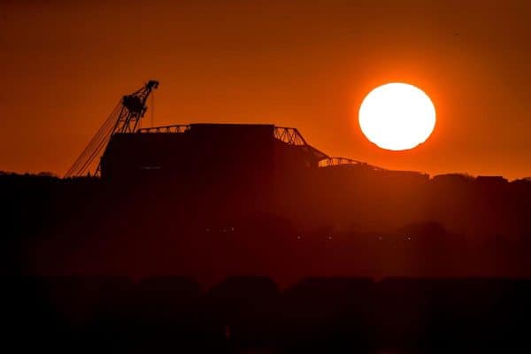 General - The sun rises behind Anfield stadium in Liverpool. (PA Media / Peter Byrne)