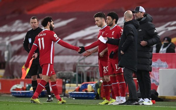 2EXGCTP Liverpool's Mohamed Salah (left) leaves the game as team-mates Diogo Jota (centre) and Alex Oxlade-Chamberlain come on during the Premier League match at Anfield, Liverpool. Picture date: Thursday March 4, 2021.