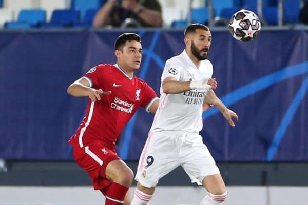 Liverpool's Ozan Kabak (left) and Real Madrid's Karim Benzema battle for the ball during the UEFA Champions League match at the Alfredo Di Stefano Stadium, Madrid. Picture date: Tuesday April 6, 2021.