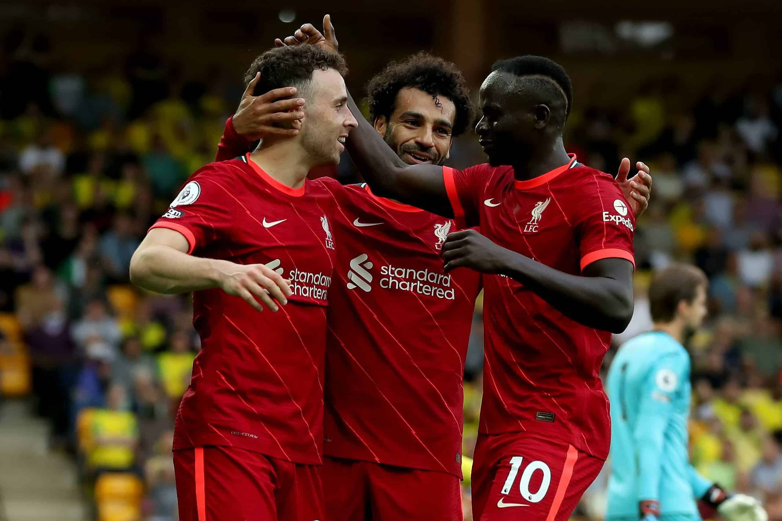 Carrow Road, Norwich, Norfolk, UK. 14th Aug, 2021. Premier League football, Norwich versus Liverpool; Diogo Jota of Liverpool celebrates with Mohamed Salah and Sadio Mane after he scores for 0-1 in the 26th minute Credit: Action Plus Sports/Alamy Live News