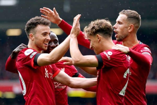 Liverpool's Diogo Jota (left) celebrates with his team-mates after scoring their side's first goal of the game during the Premier League match at Anfield, Liverpool. Picture date: Saturday August 21, 2021. (Mike Egerton / Alamy Photo)