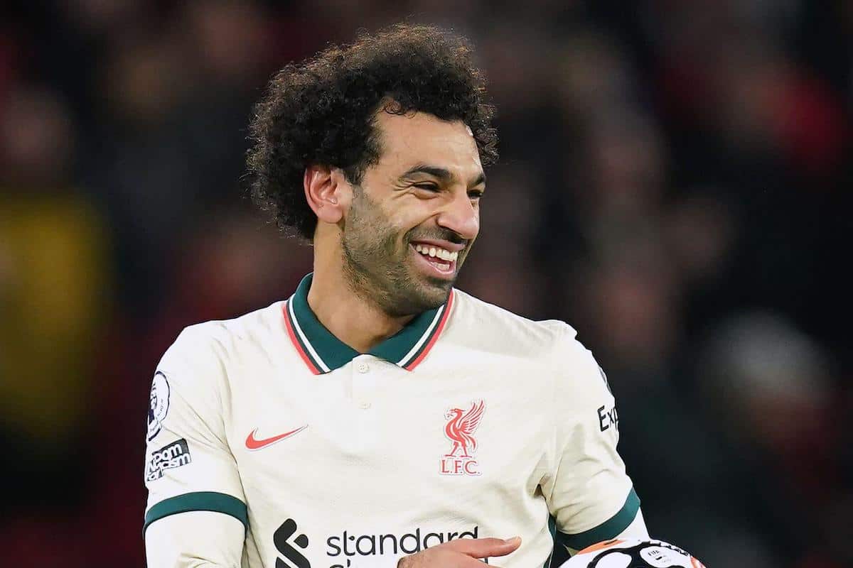 Liverpool hat-trick scorer Mohamed Salah (left) celebrates with the match ball after the final whistle during the Premier League match at Old Trafford, Manchester. Picture date: Sunday October 24, 2021.