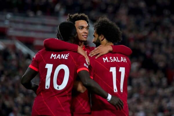 2H75KE5 Liverpool's Mohamed Salah (right) celebrates with his team-mates Sadio Mane and Trent Alexander-Arnold after scoring their side's third goal of the game during the Premier League match at Anfield, Liverpool. Picture date: Saturday November 20, 2021.