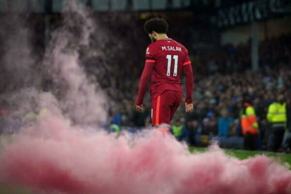 2H8R9KA A smoke flare lands on the pitch as Liverpool's Mohamed Salah celebrates scoring their side's third goal during the Premier League match between Everton and Liverpool at Goodison Park, Liverpool. Picture date: Wednesday December 1, 2021.