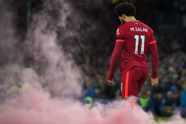 2H8R9KA A smoke flare lands on the pitch as Liverpool's Mohamed Salah celebrates scoring their side's third goal during the Premier League match between Everton and Liverpool at Goodison Park, Liverpool. Picture date: Wednesday December 1, 2021.