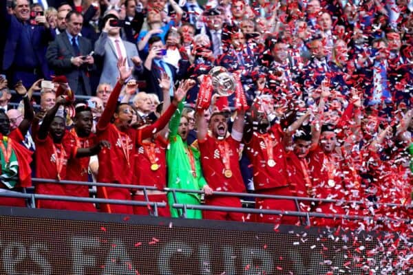 2J8AD7P Liverpool's Jordan Henderson (centre) lifts the trophy as he celebrates with his team-mates after winning the Emirates FA Cup final at Wembley Stadium, London. Picture date: Saturday May 14, 2022.