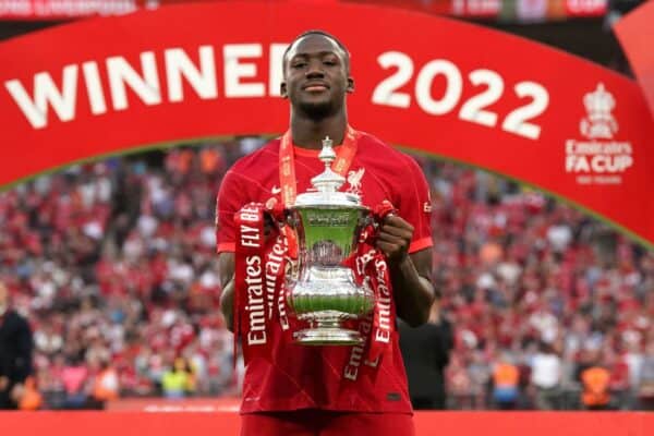 Liverpool's Ibrahima Konate poses with the trophy after the Emirates FA Cup final at Wembley Stadium, London. Picture date: Saturday May 14, 2022. (Image: PA Images / Alamy Stock Photo)