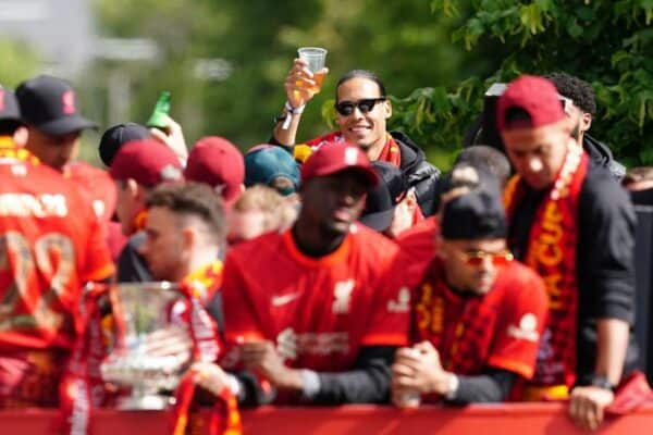 2JAB01D Liverpool's Virgil van Dijk (background) raises a cup in a open-top bus during the trophy parade in Liverpool. Picture date: Sunday May 29, 2022.