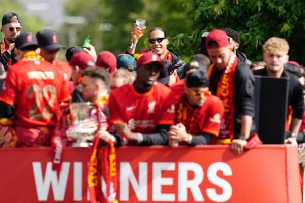 2JAB01D Liverpool's Virgil van Dijk (background) raises a cup in a open-top bus during the trophy parade in Liverpool. Picture date: Sunday May 29, 2022.