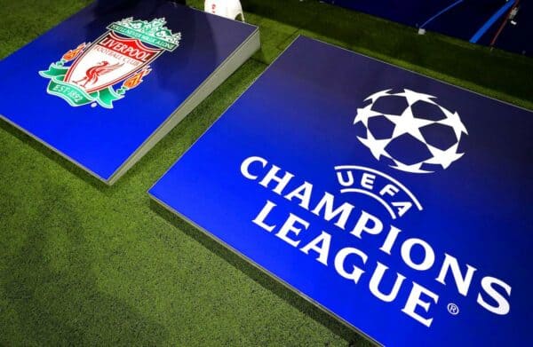 A general view of the Liverpool club crest next to UEFA Champions League signage (PA media / Alamy)