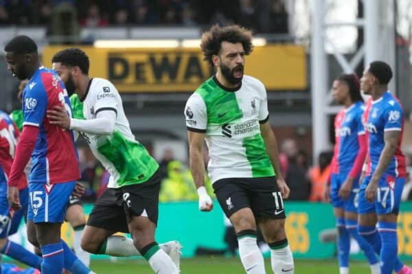 2TBY67W Liverpool's Mohamed Salah, centre, celebrates after scoring his side's opening goal during the Premier League soccer match between Crystal Palace and Liverpool at Selhurst Park, in London, England, Saturday, Dec. 9, 2023. (AP Photo/Kin Cheung)