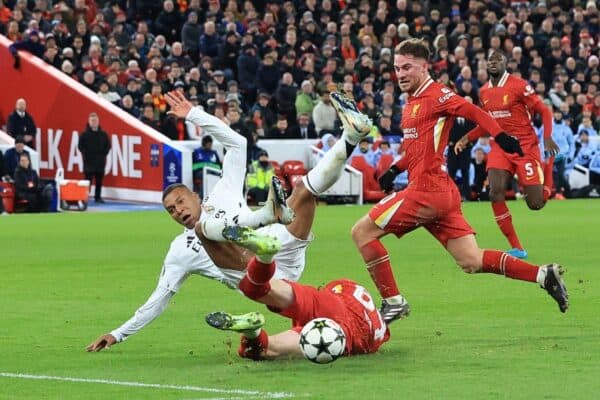 2YP03W0 Anfield, Liverpool, Merseyside, UK. 27th Nov, 2024. Champions League Football, Liverpool versus Real Madrid; Conor Bradley of Liverpool wins the ball from Kylian Mbappe of Real Madrid with a sliding tackle Credit: Action Plus Sports/Alamy Live News