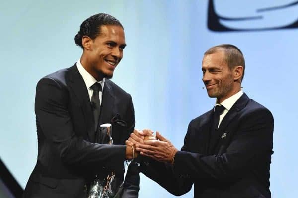 MONACO, MONACO - AUGUST 29: UEFA President, Aleksander eferin presents Virgil van Dijk with the UEFA Men's Player of the Year 2018/19 Award during the UEFA Champions League Draw, part of the UEFA European Club Football Season Kick-Off 2019/2020 at Salle des Princes, Grimaldi Forum on August 29, 2019 in Monaco, Monaco. (Photo by Harold Cunningham - UEFA/UEFA via Getty Images)