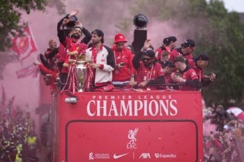 Liverpool players celebrate with the trophy on top of a bus during the Liverpool FC Premier League victory parade in Liverpool, England, Monday, May 26, 2025.(AP Photo/Jon Super)