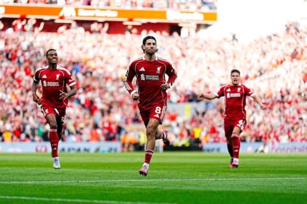 Dominik Szoboszlai (centre) celebrates scoring their side's first goal during the Premier League match at Anfield, Liverpool. Picture date: Sunday August 31, 2025. (Alamy Photo)