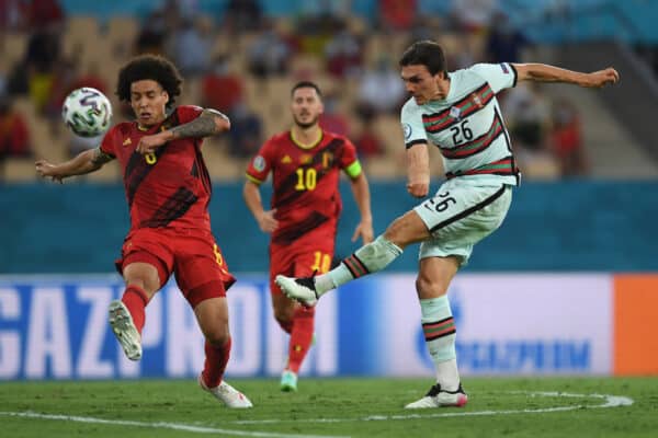 SEVILLE, SPAIN - JUNE 27: Joao Palhinha of Portugal shoots whilst under pressure from Axel Witsel of Belgium during the UEFA Euro 2020 Championship Round of 16 match between Belgium and Portugal at Estadio La Cartuja on June 27, 2021 in Seville, Spain. (Photo by Aitor Alcalde - UEFA)