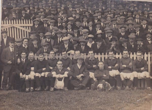 (Please credit within piece: The Bromilow family) The Liverpool squad, including manager David Ashworth, Elisha Scott, Tom Bromilow, Walter Wadsworth and Dick Forshaw sit in front of the Kop, 1920s