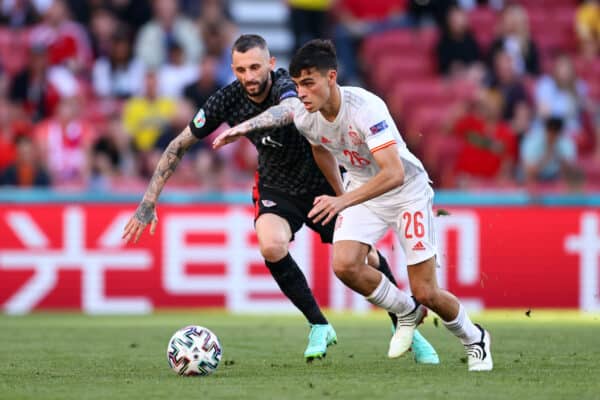 COPENHAGEN, DENMARK - JUNE 28: Pedri of Spain battles for possession with Marcelo Brozovic of Croatia during the UEFA Euro 2020 Championship Round of 16 match between Croatia and Spain at Parken Stadium on June 28, 2021 in Copenhagen, Denmark. (Photo by Martin Rose - UEFA)