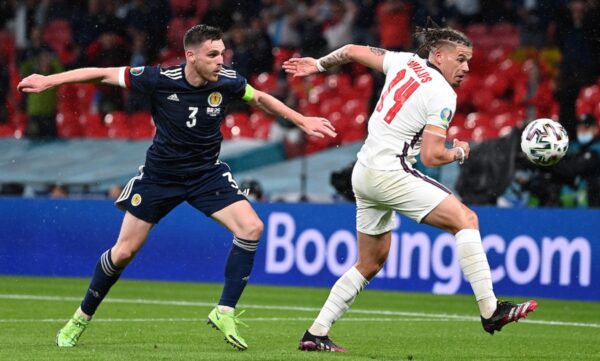 LONDON, ENGLAND - JUNE 18: Andrew Robertson of Scotland battles for possession with Kalvin Phillips of England during the UEFA Euro 2020 Championship Group D match between England and Scotland at Wembley Stadium on June 18, 2021 in London, England. (Photo by Shaun Botterill - UEFA/UEFA via Getty Images)