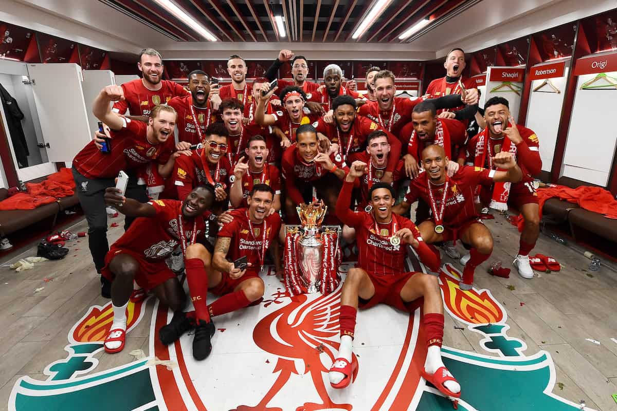 Trent Alexander-Arnold, Georginio Wijnaldum, Naby Keita, Roberto Firmino, Alex Oxlade-Chamberlain, Fabinho, Andy Robertson, Virgil van Dijk, James Milner, Joe Gomez, Curtis Jones, Adrian, Divock Origi, Adam Lallana, Harvey Elliott, Joel Matip, Xherdan Shaqiri, Jordan Henderson captain of Liverpool and Jurgen Klopp manager of Liverpool celebrating in the dressing room with the premier league trophy after winning the Premier league at the end of the Premier League match between Liverpool FC and Chelsea FC at Anfield on July 22, 2020 in Liverpool, England. Football Stadiums around Europe remain empty due to the Coronavirus Pandemic as Government social distancing laws prohibit fans inside venues resulting in all fixtures being played behind closed doors. (Photo by Andrew Powell/Liverpool FC via Getty Images)