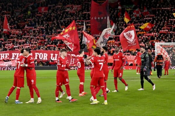 Liverpool FC players on the pitch at Anfield pre-match, flags, Kop, squad (Photo by Andrew Powell/Liverpool FC via Getty Images)