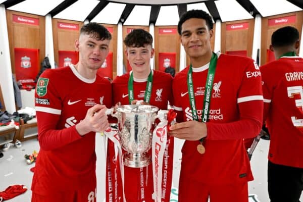 Conor Bradley, Ryan Gravenberch and James McConnell of Liverpool with the Carabao Cup in the dressing room after the Carabao Cup Final between Chelsea and Liverpool at Wembley Stadium on February 25, 2024 in London, England. (Photo by Andrew Powell/Liverpool FC via Getty Images)