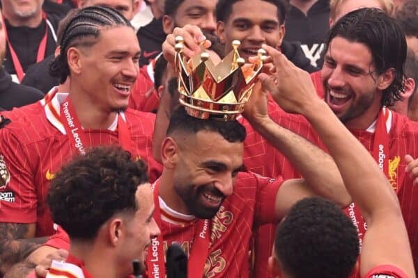 Mohamed Salah of Liverpool has the crown from the Premier League trophy placed on his head, as players celebrate as Liverpool are crowned the Champions of the Premier League for the 2024/25 Season following the Premier League match between Liverpool FC and Crystal Palace FC at Anfield on May 25, 2025 in Liverpool, England. (Photo by Liverpool FC/Liverpool FC via Getty Images)