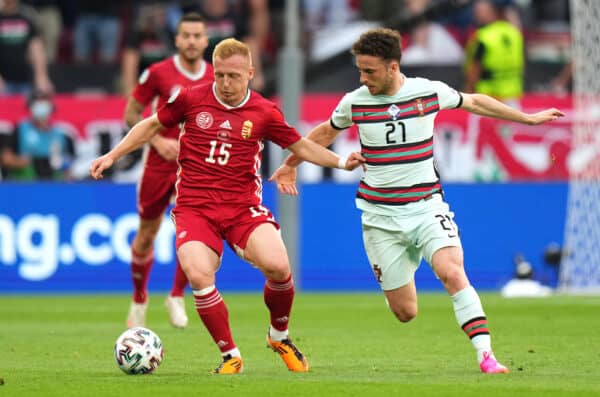 BUDAPEST, HUNGARY - JUNE 15: Laszlo Kleinheisler of Hungary is closed down by Diogo Jota of Portugal during the UEFA Euro 2020 Championship Group F match between Hungary and Portugal at Puskas Arena on June 15, 2021 in Budapest, Hungary. (Photo by Angel Martinez - UEFA/UEFA via Getty Images)