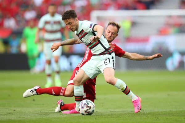 BUDAPEST, HUNGARY - JUNE 15: Diogo Jota of Portugal battles for possession with Gergo Lovrencsics of Hungary during the UEFA Euro 2020 Championship Group F match between Hungary and Portugal at Puskas Arena on June 15, 2021 in Budapest, Hungary. (Photo by Alex Livesey - UEFA/UEFA via Getty Images)